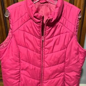 Dark pink puffy vest. No brand no size but fits like a large
